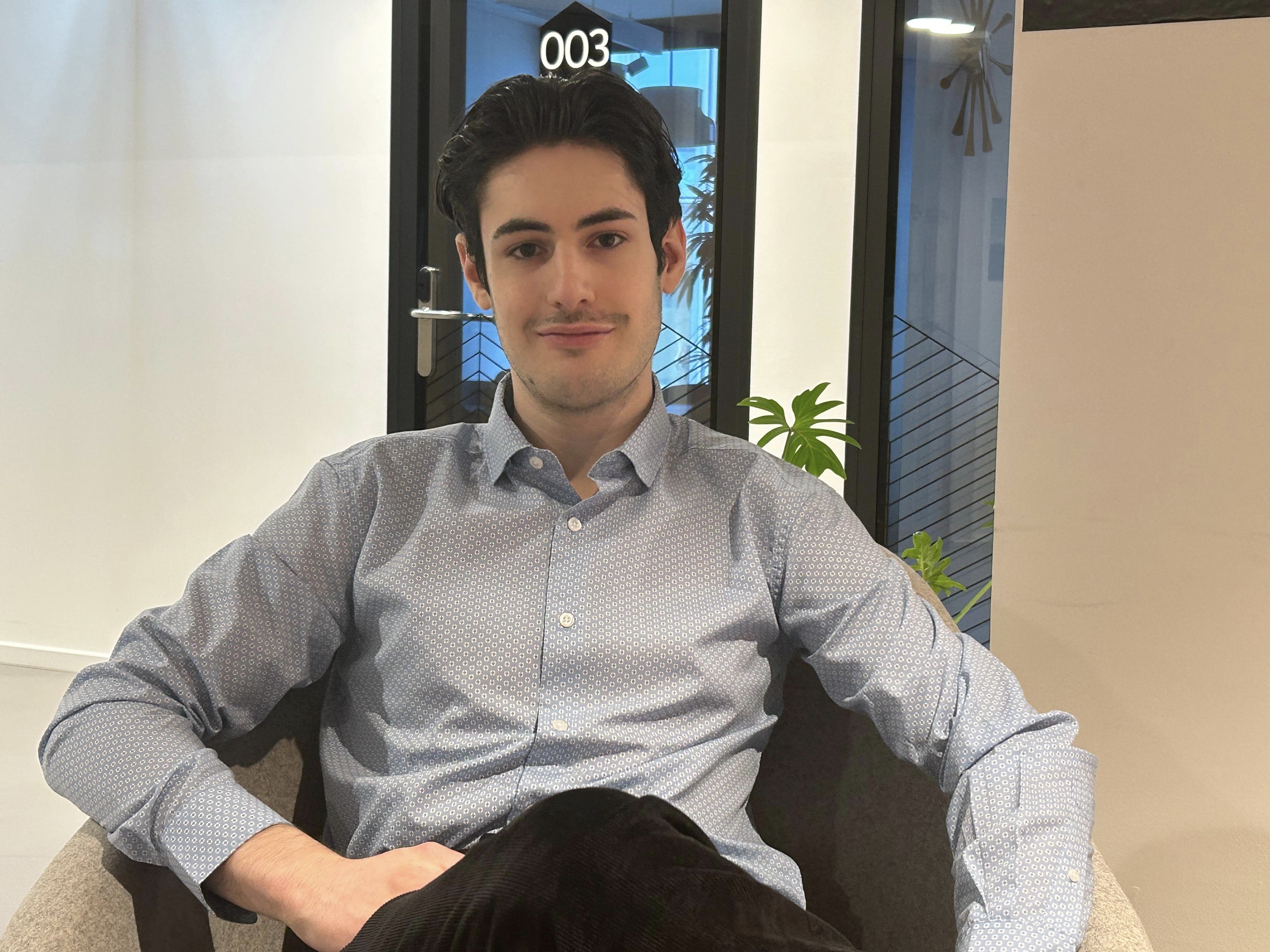Interior of a cafe or workspace with several people at tables