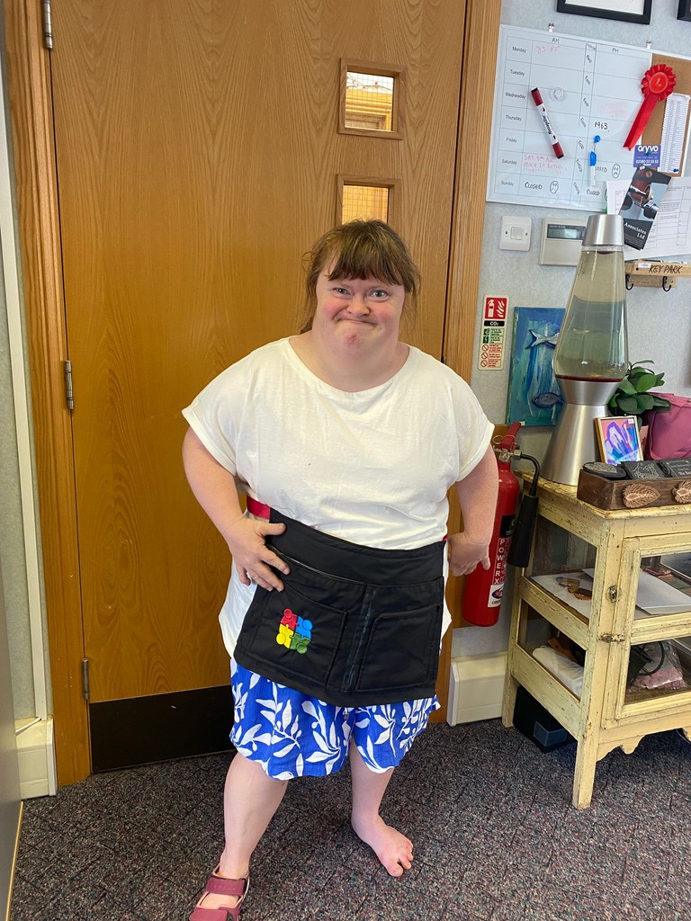 A man stading with Surfboard