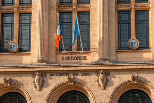 Sorbonne university of paris building with french flags