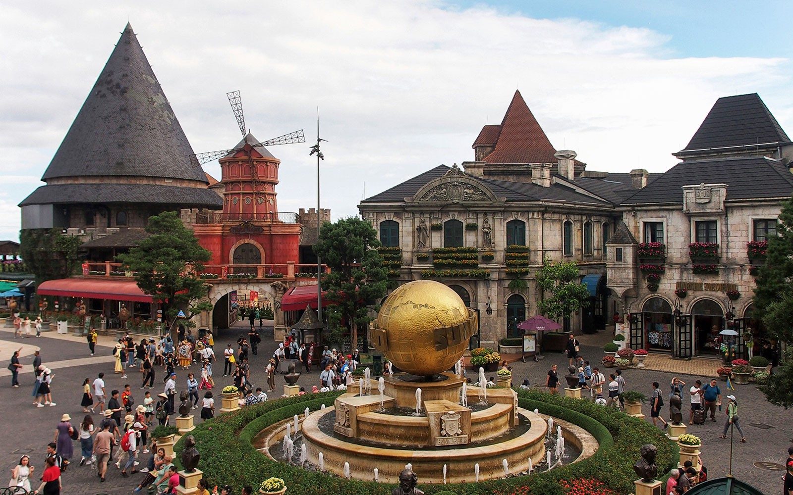 Central square in Ba Na Hills with globe fountain and European-style buildings.
