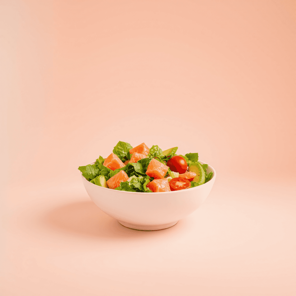 product photography of a bowl of salad with salmon, cherry tomatoes, and avocado