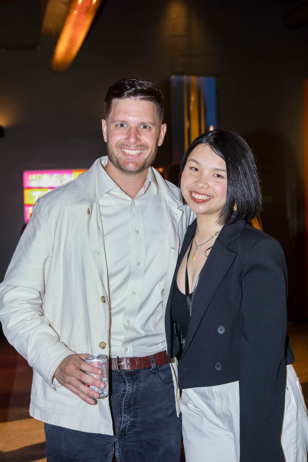 a group of students smiling for the camera in the SVA Theatre lobby after the Venture Forum