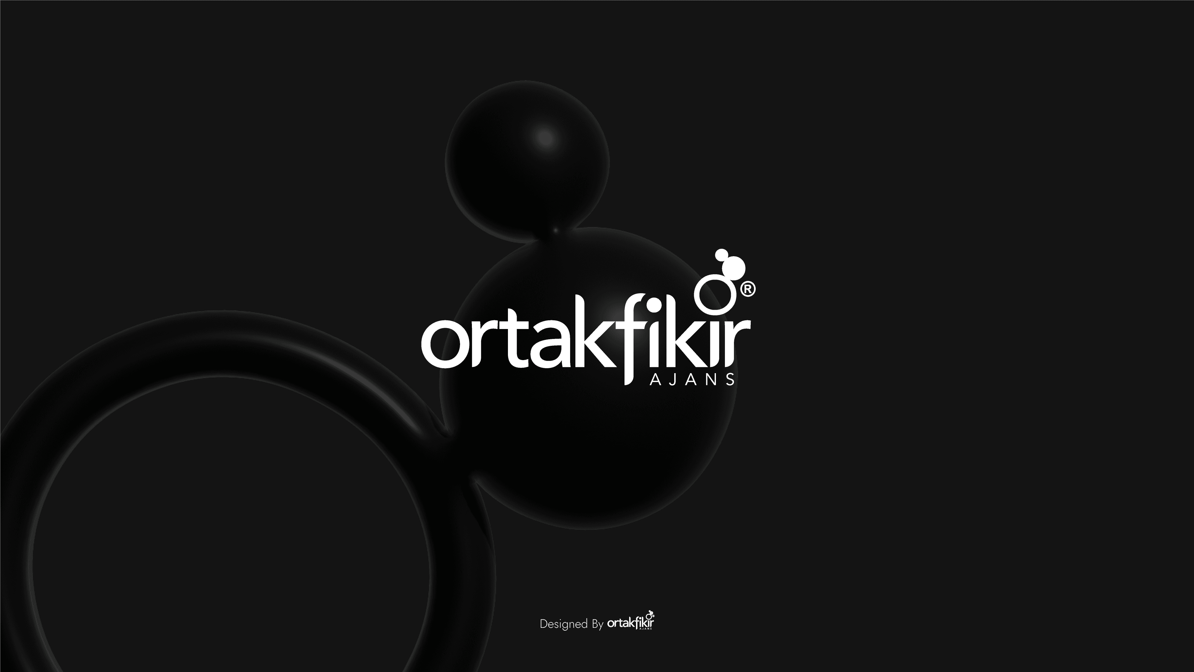 Abstract macro of a glass drop forming a black-and-white flower shape through light refraction on a soft gray background.