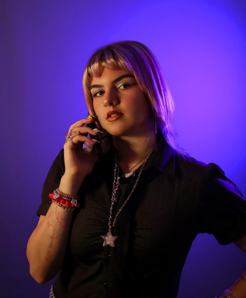 portrait of girl holding Y2K phone to ear