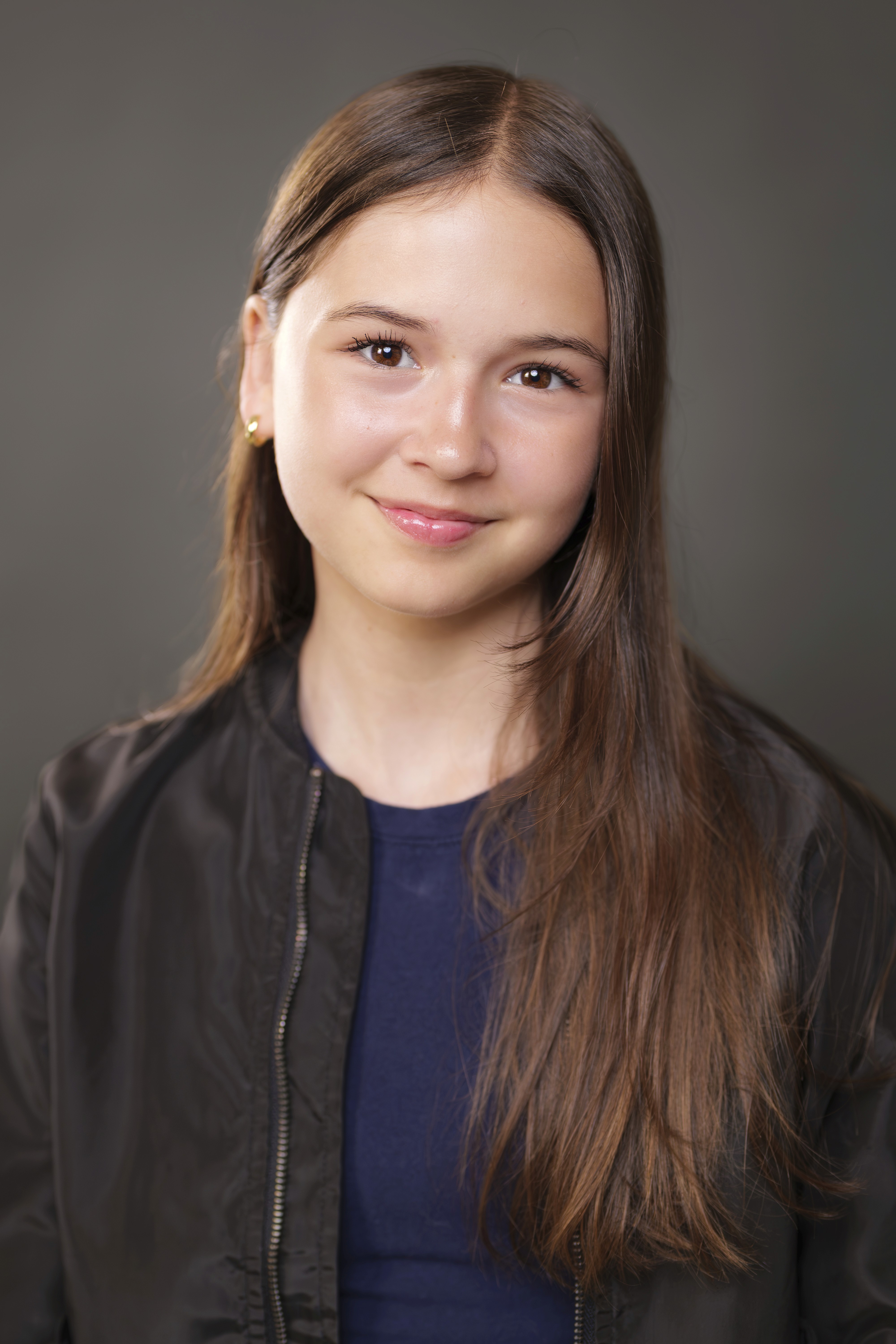 young woman smiling in black jacket in professional headshot in Claremont CA | FFotos
