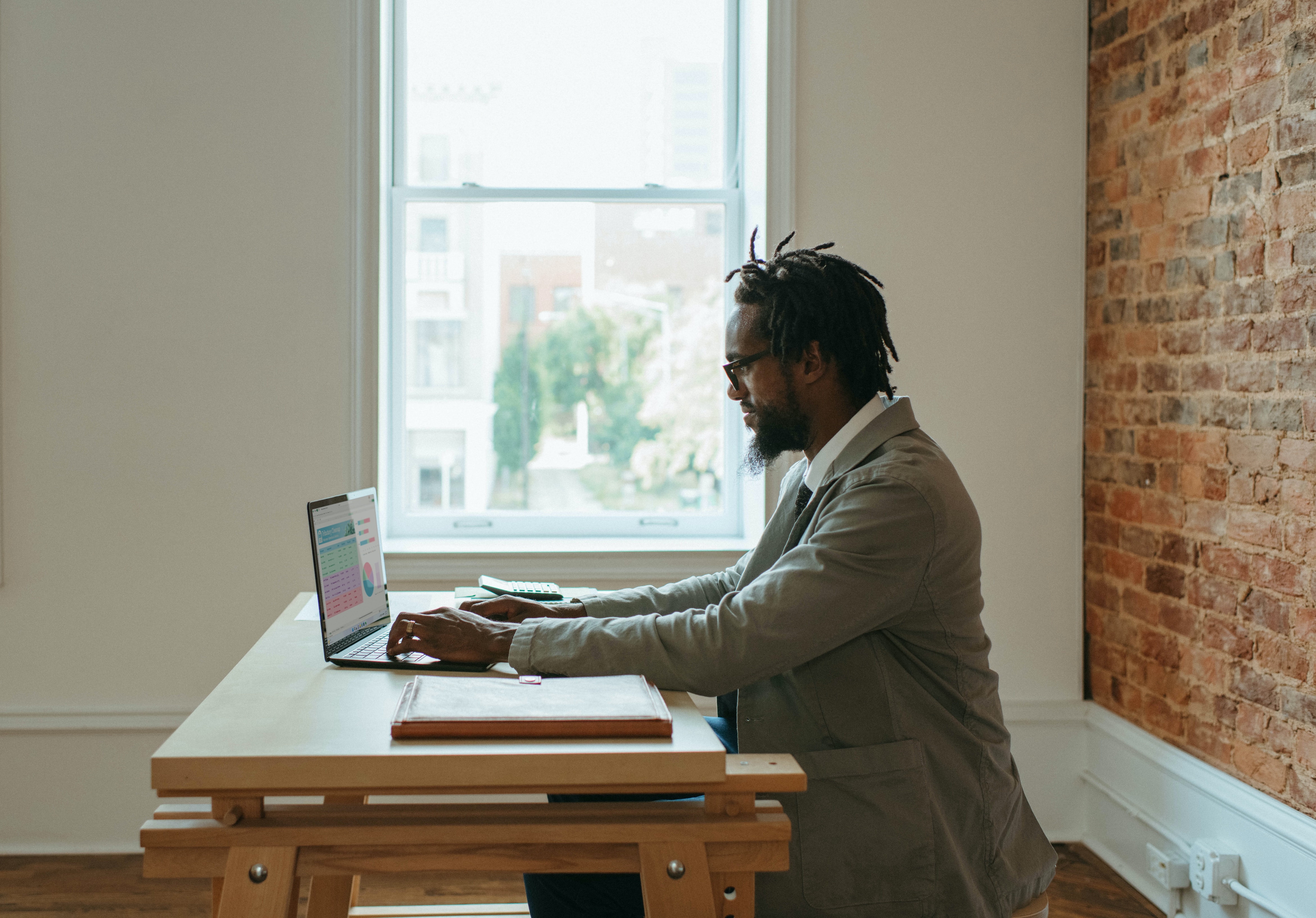 man working on his office task of analytics - how to do sentiment analysis