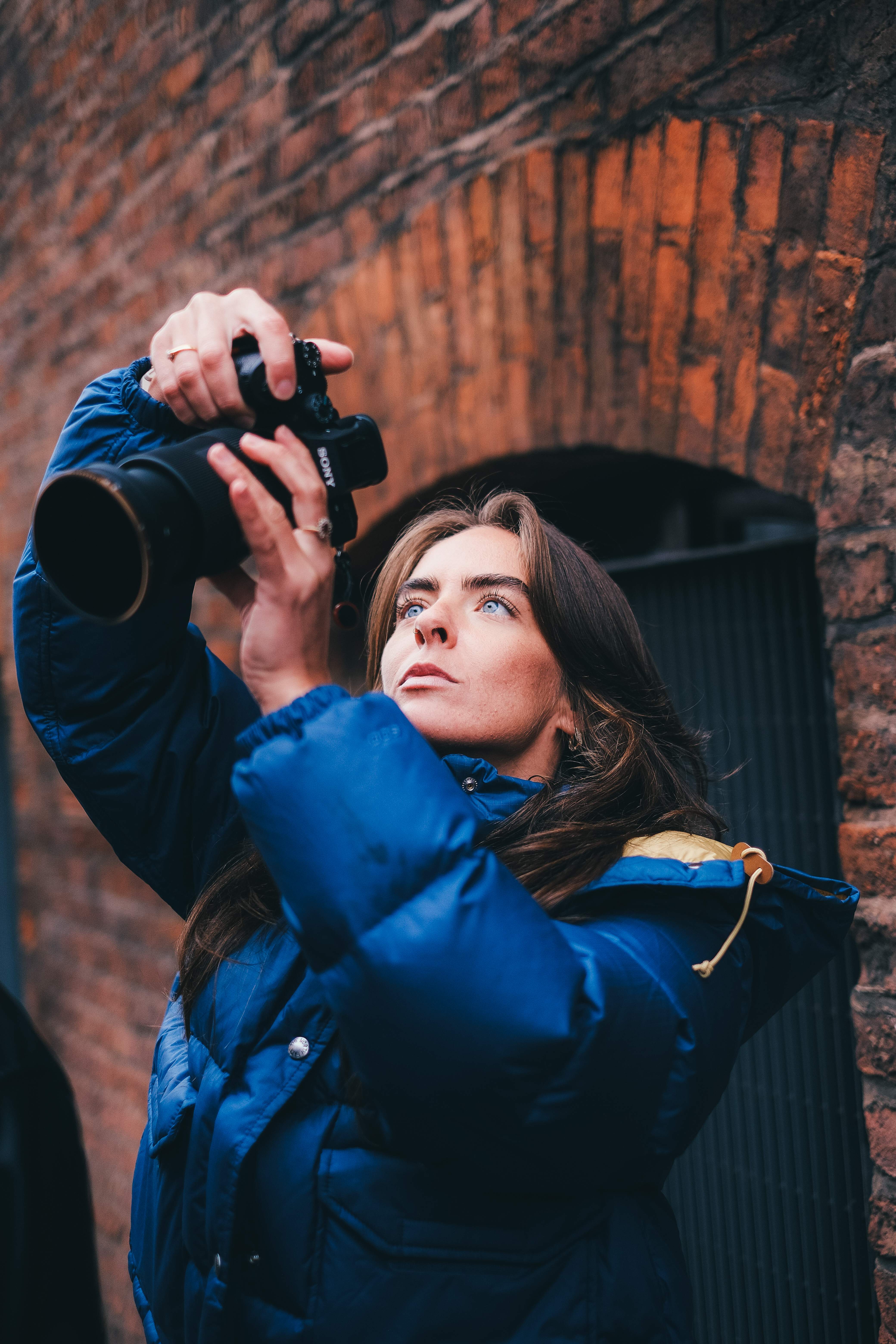 Professional headshot of a person in a formal setting.