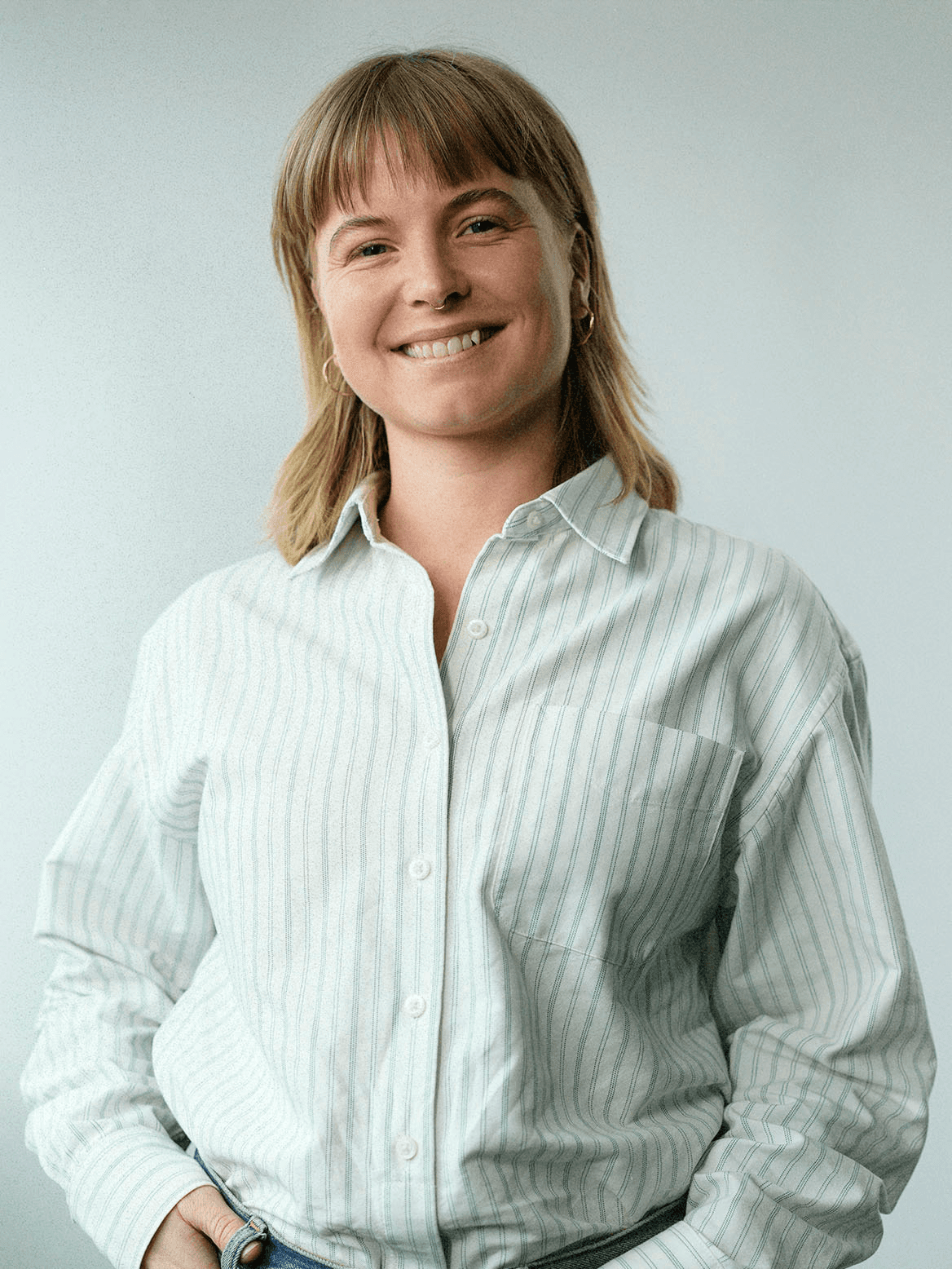 man standing beside wall