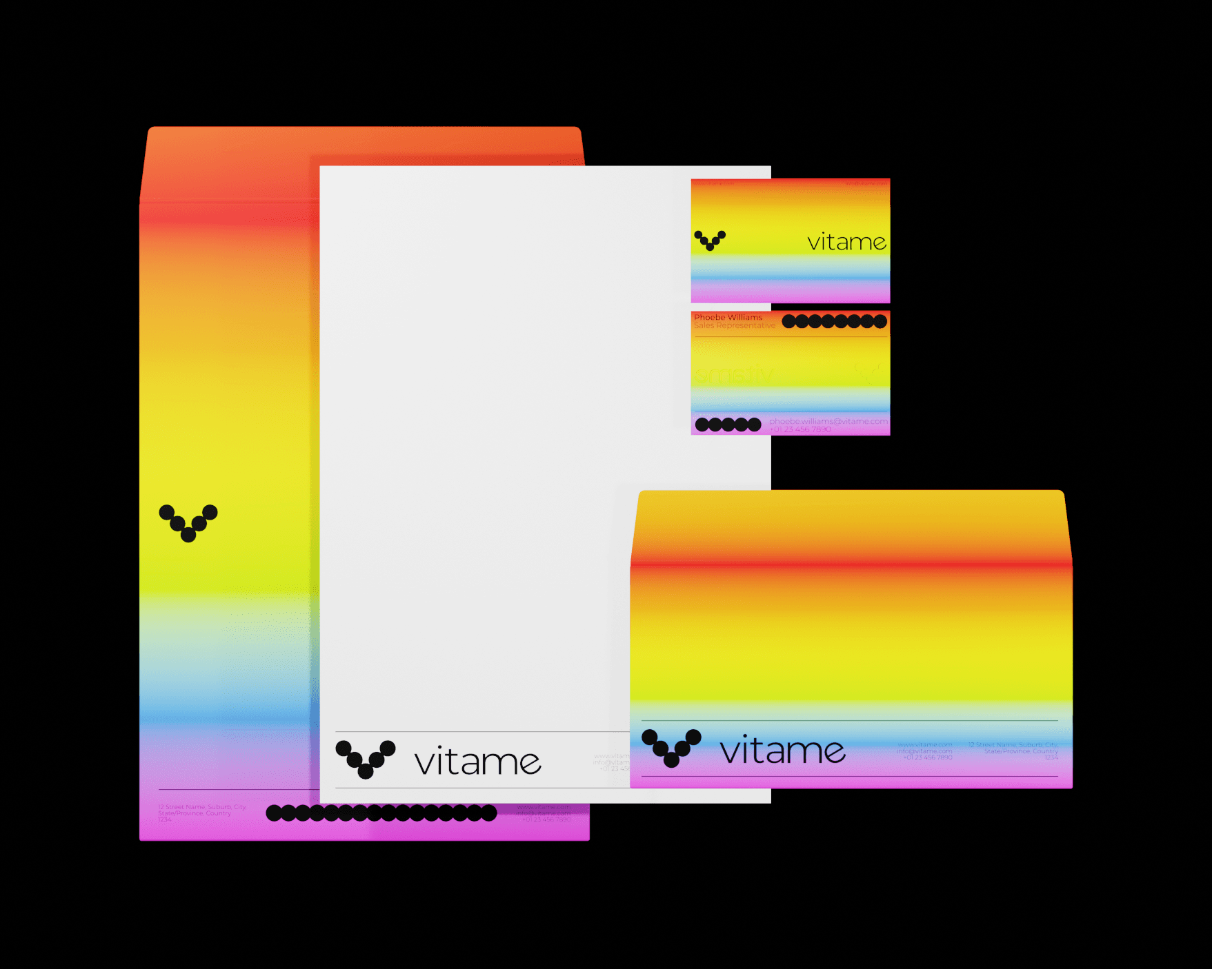 A mockup of Vitame's business cards, letterheads, and envelope designs. The envelopes and business cards feature a vibrant rainbow gradient with the brand's logo design on them. The letterhead is featured on a plain white page, showing the logo at the bottom of the page.