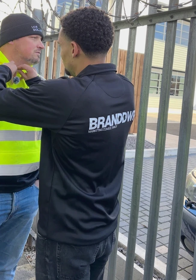 Branddwr team fitting a microphone on an installer