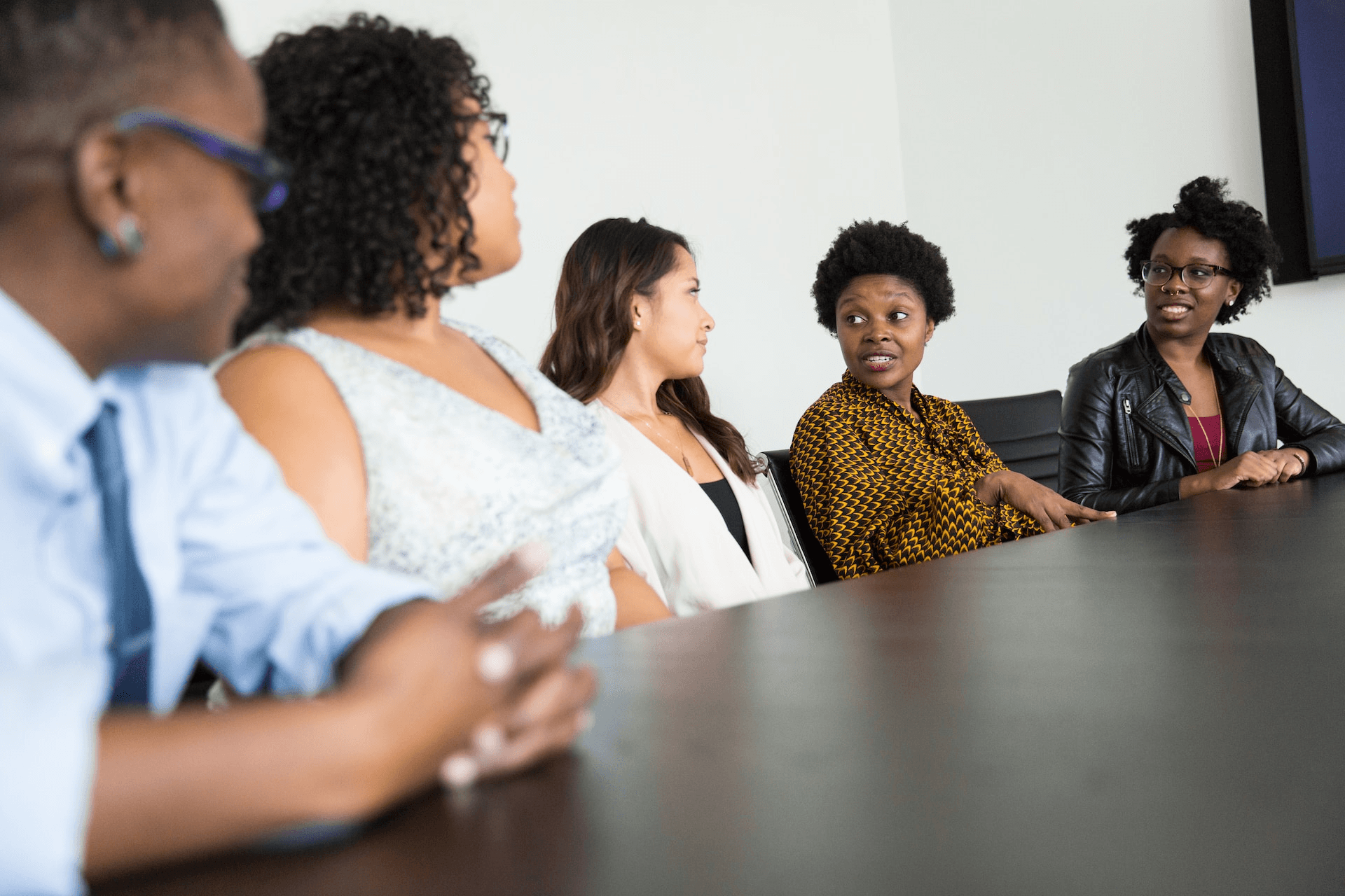 A diverse group of people discussing a startup team composition