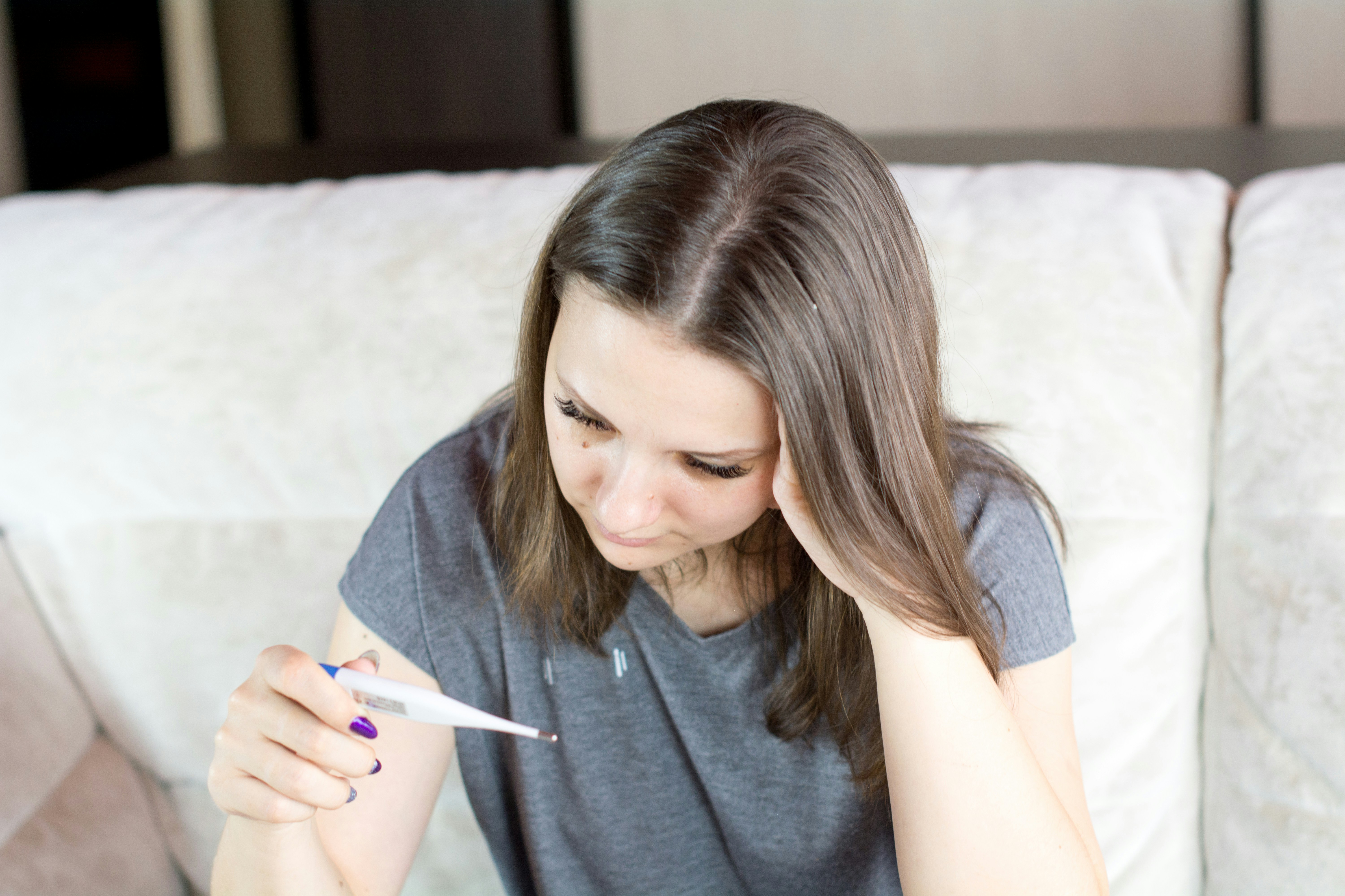 Girl Holding Thermometer