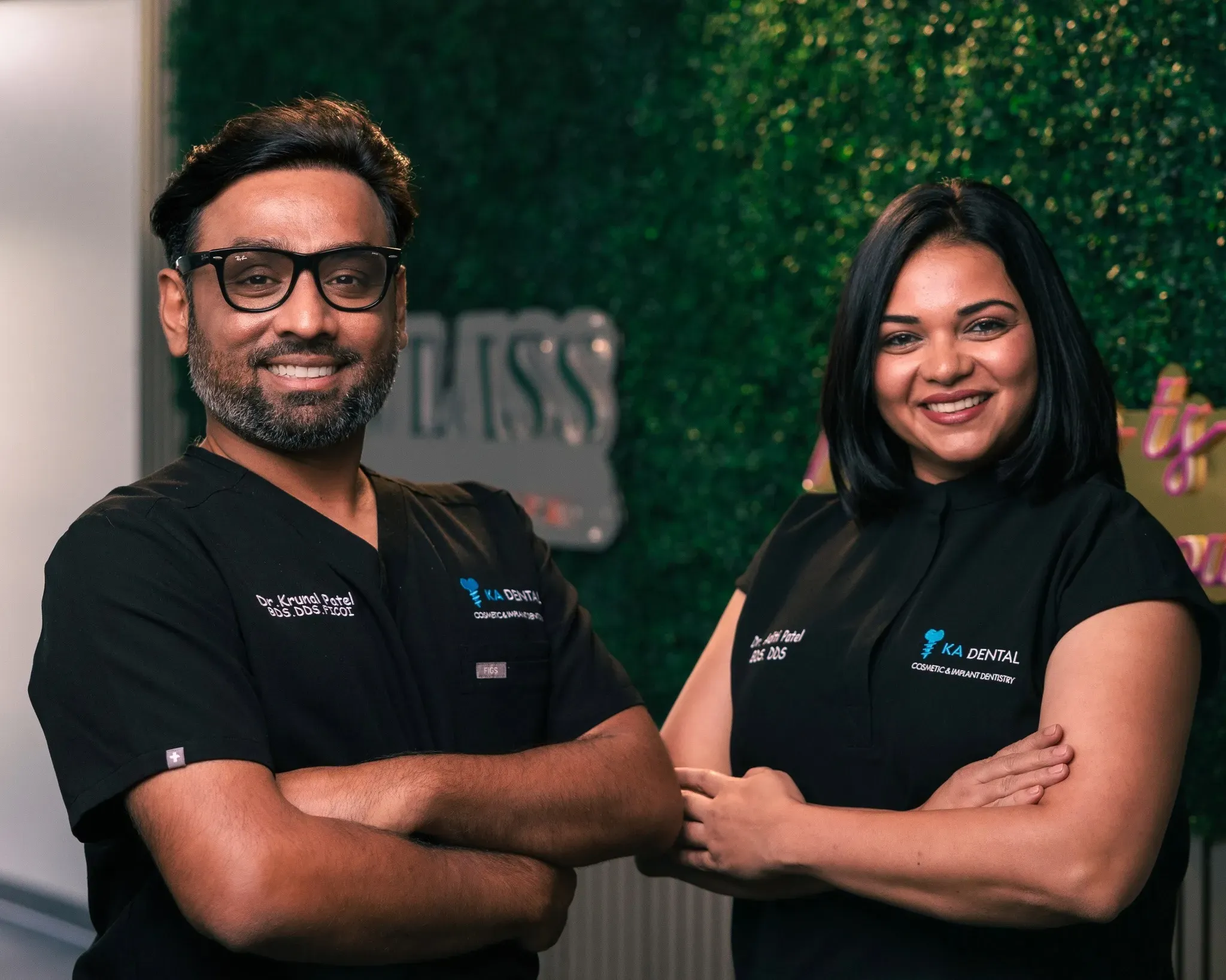 Happy patient displaying their new smile after same-day dental implants