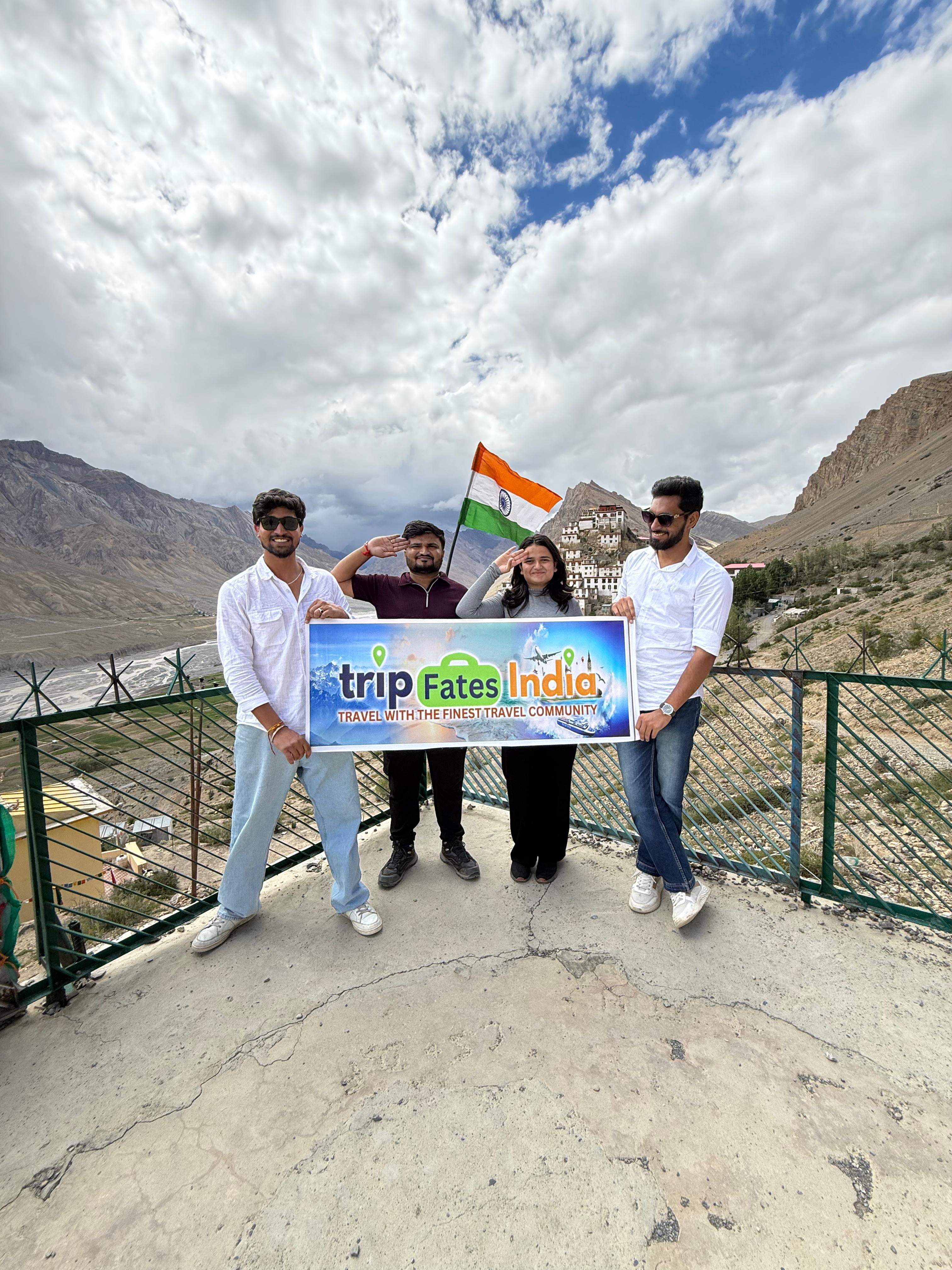 sitting woman carrying backpack overlooking canyon during daytime