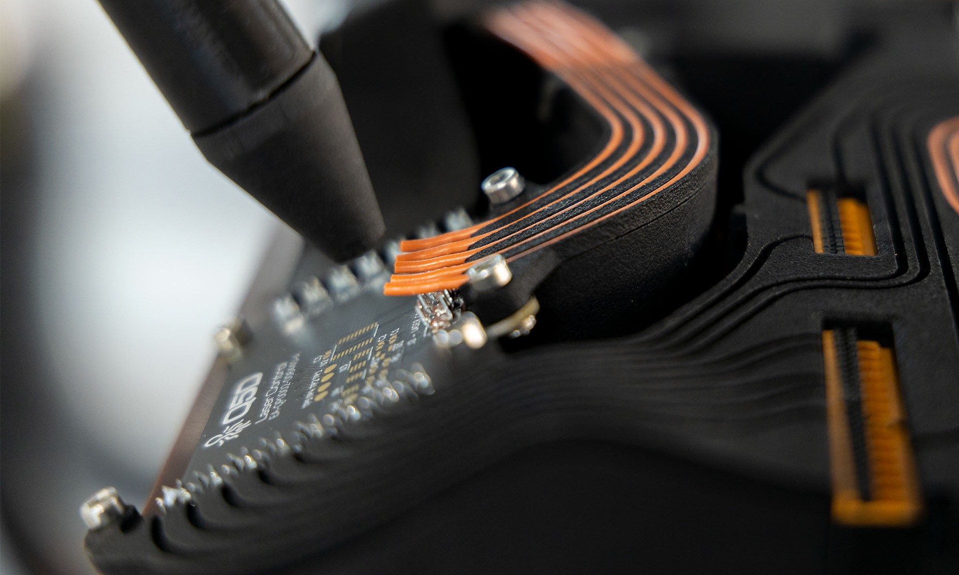 A photo of wiring being 3D printed