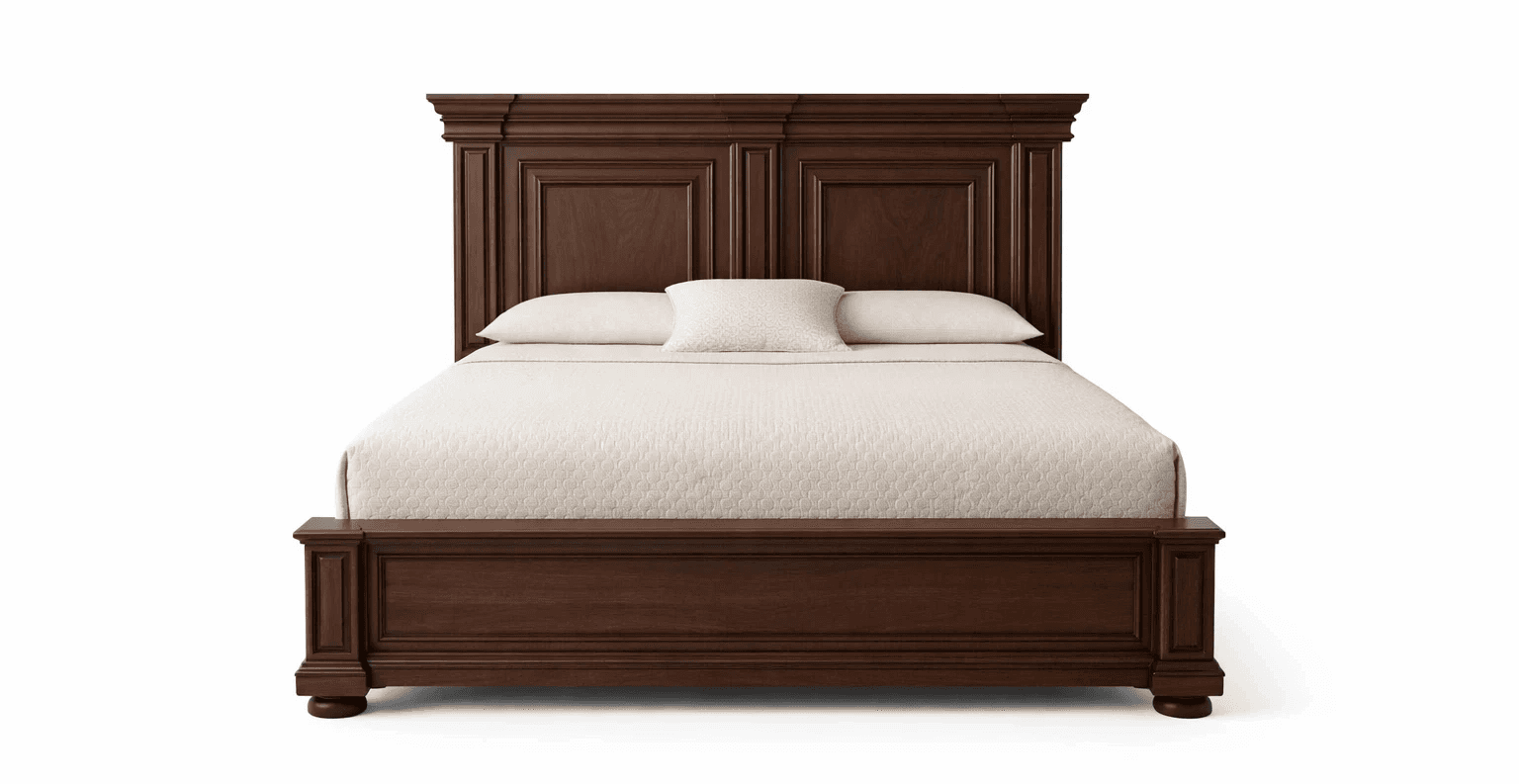 Classic wooden bed with stepped headboard design and broad side rails