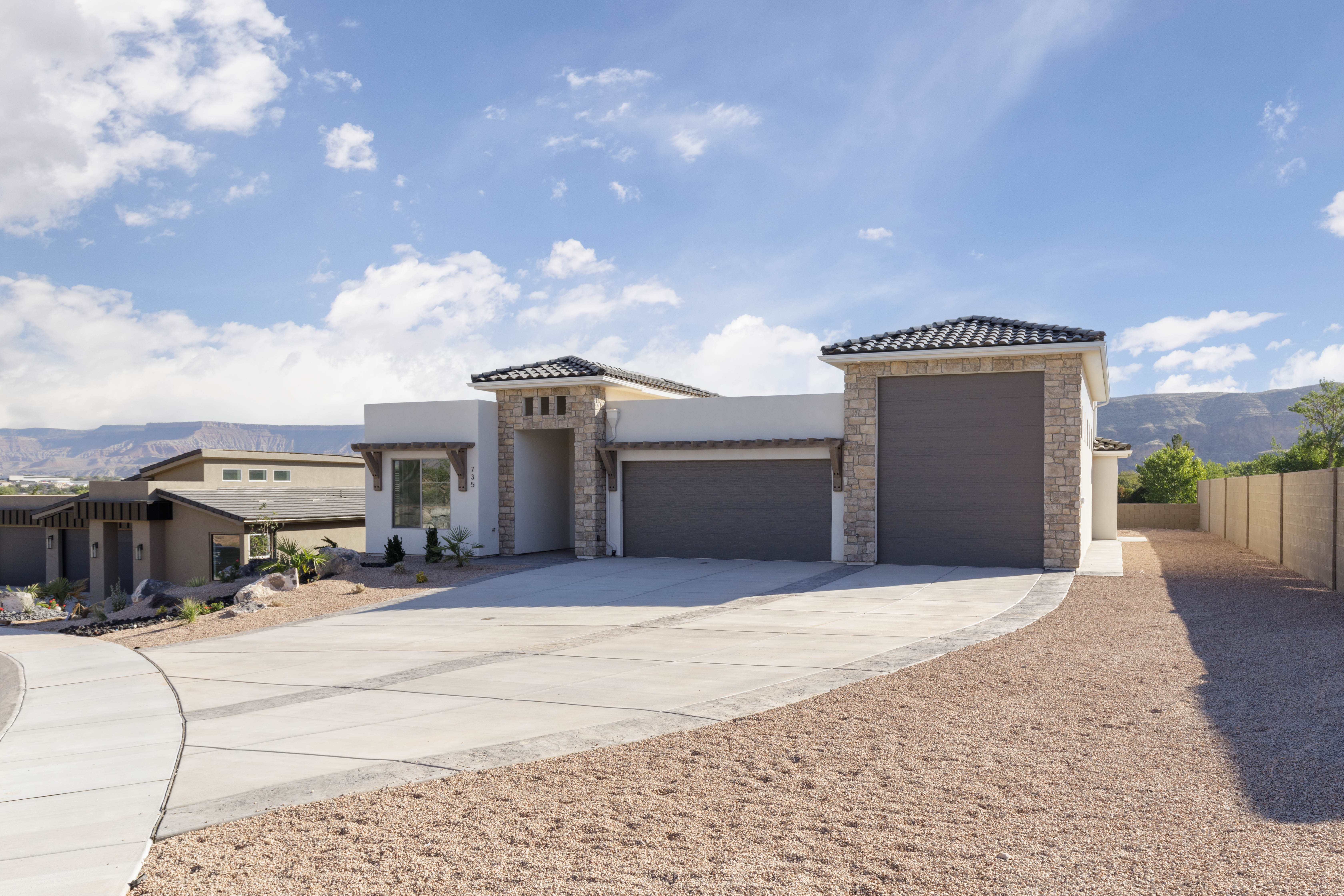 Angled front view of The Meridian new construction home in Hurricane Utah showcasing modern design.