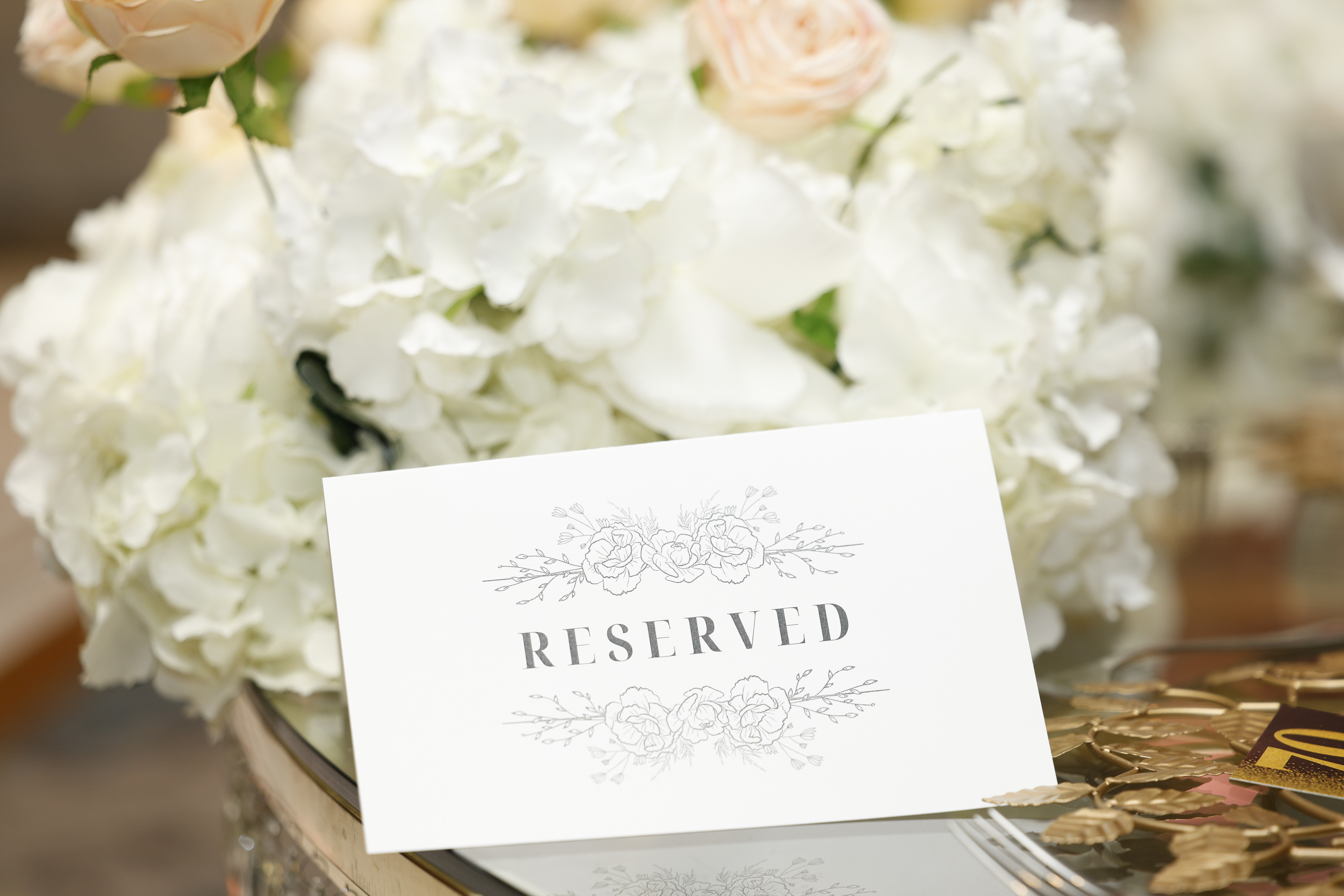 Glass of white wine held on a table