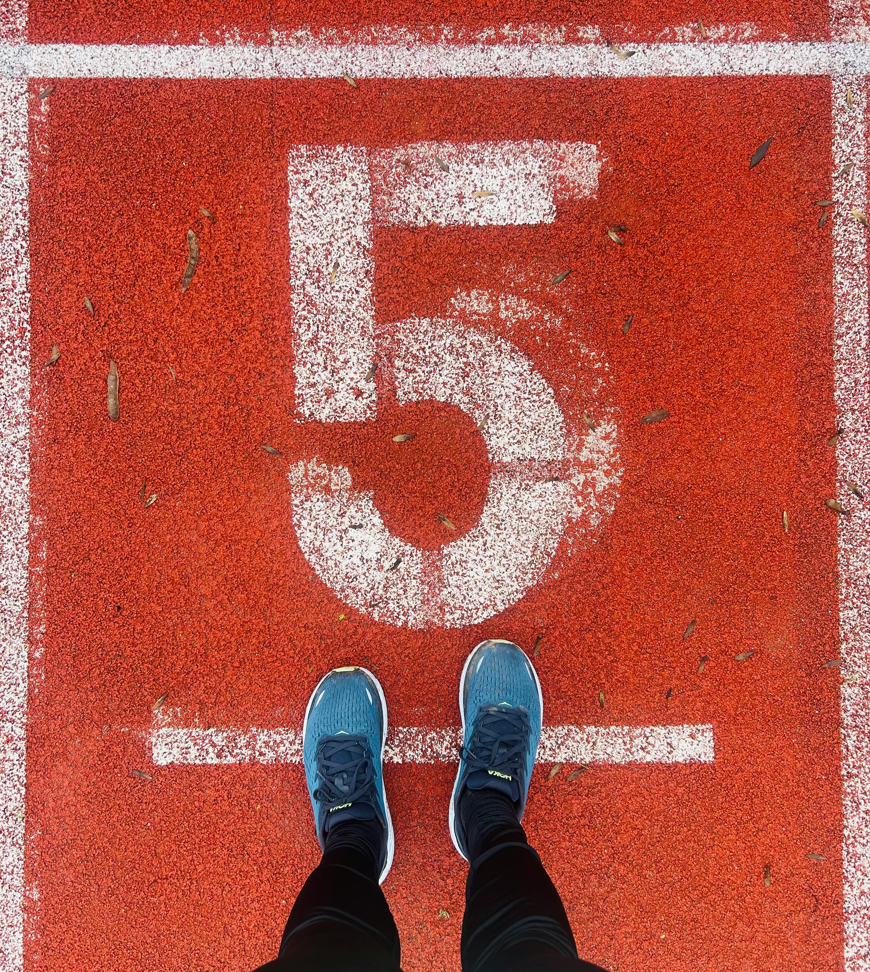 a picture showing feet of person and number 5