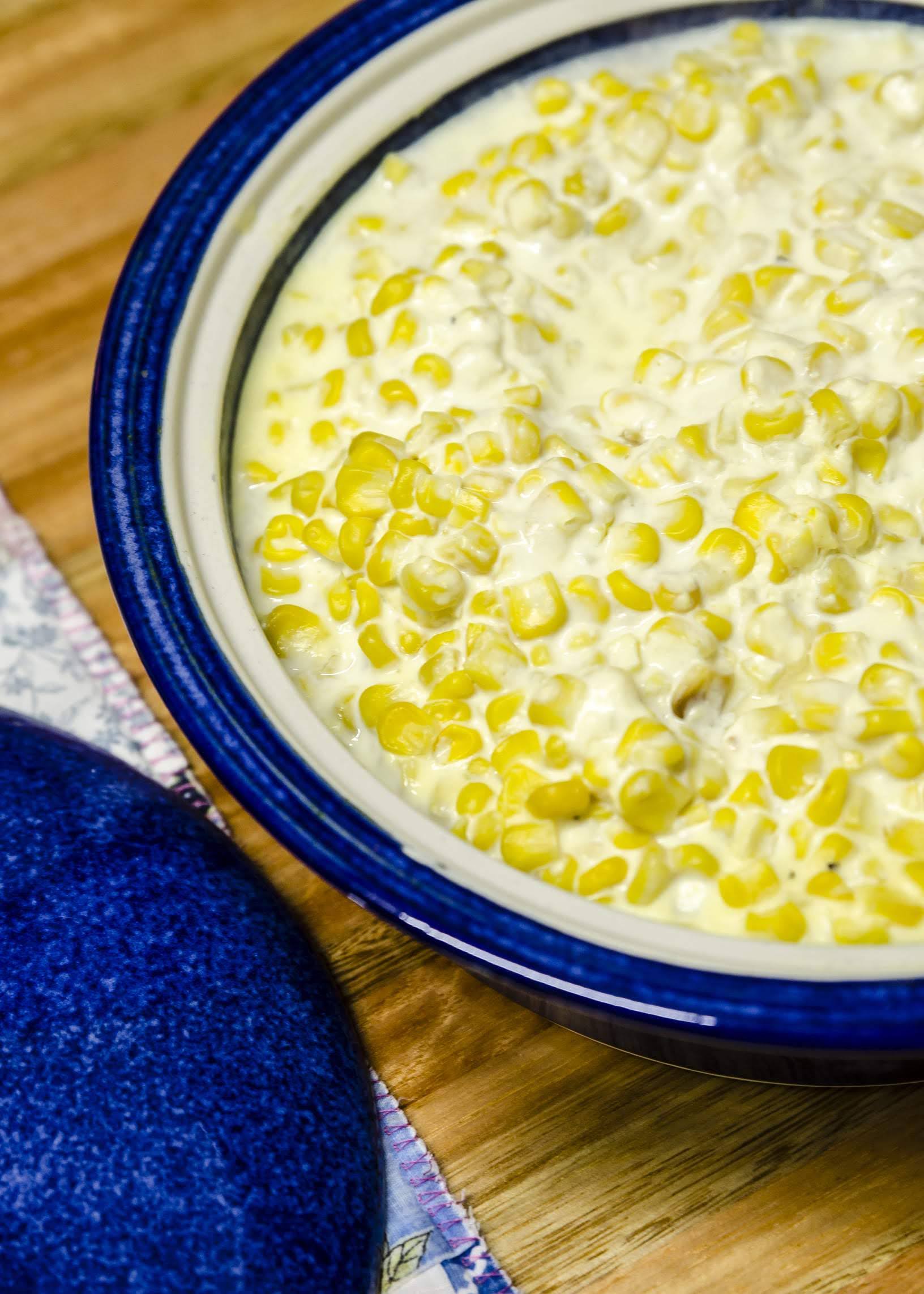 Creamed corn in a blue bowl on a table at Somerset View Guest House.