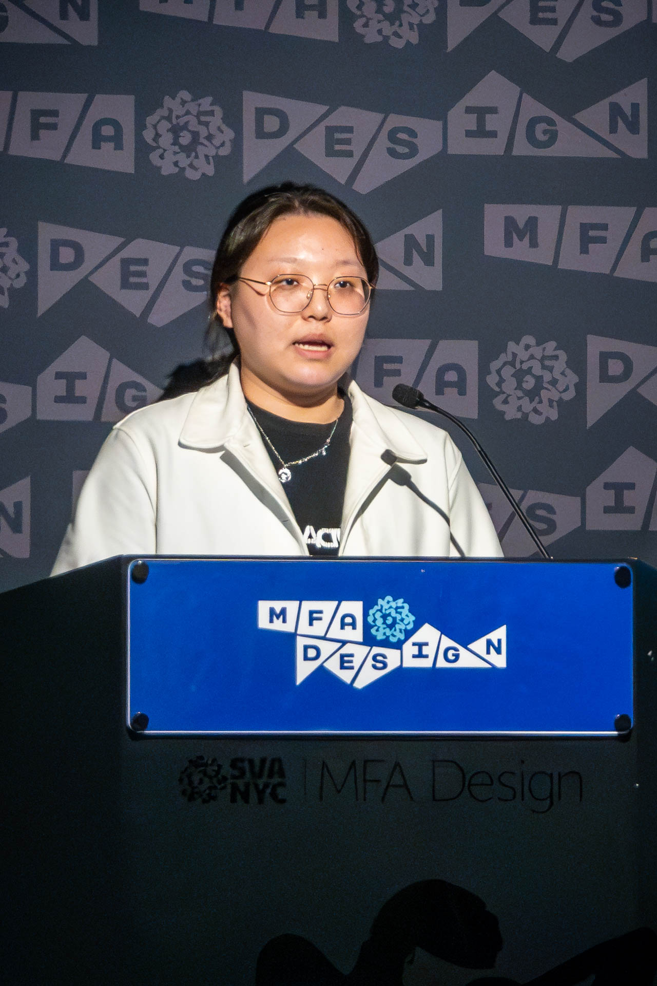 student at a podium giving a presentation