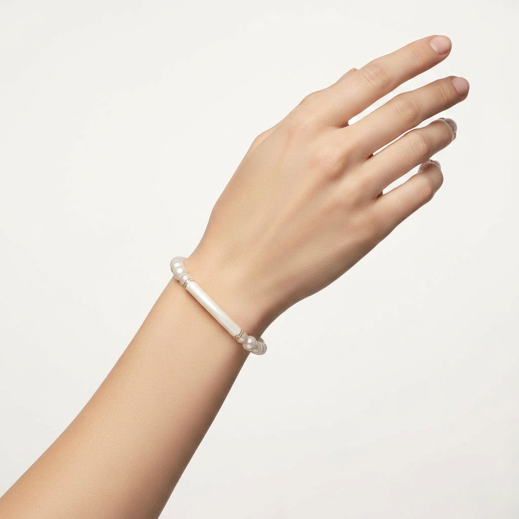 Woman wearing Ivory Pearl Bangle