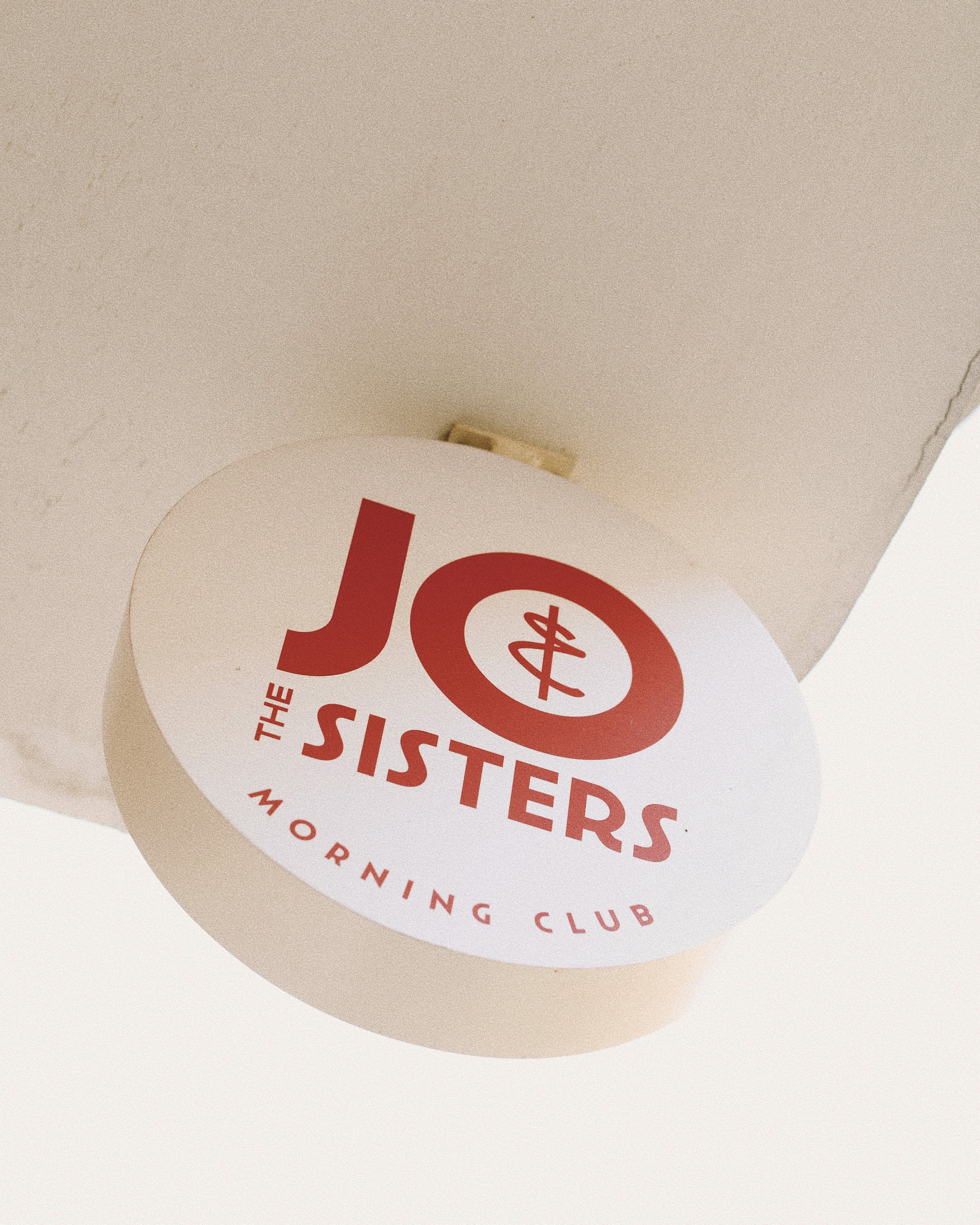 Jo & The Sisters Morning Club logo sign on the wall.