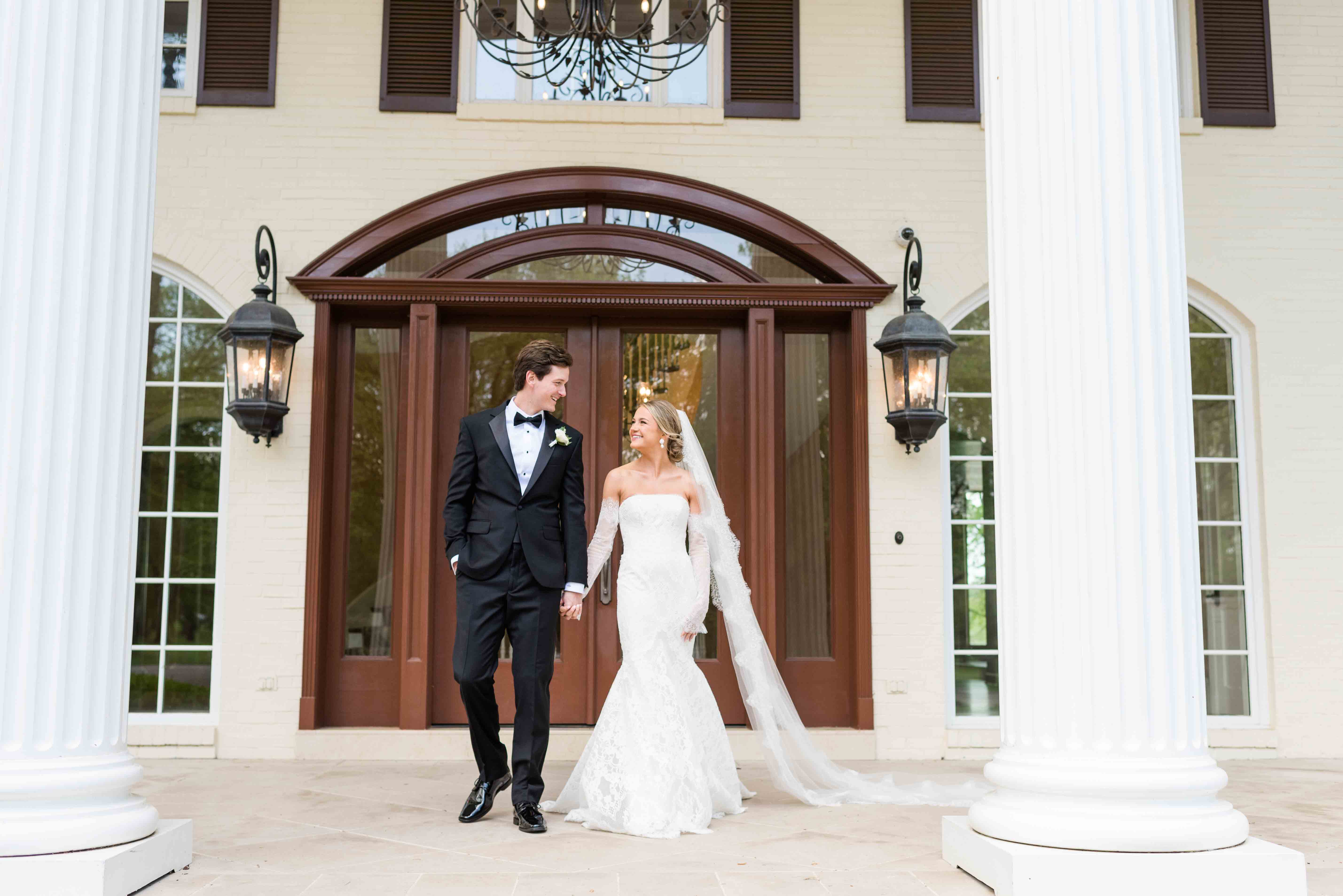 Bride and groom walking on the front of the Cherokee Docks Estate.