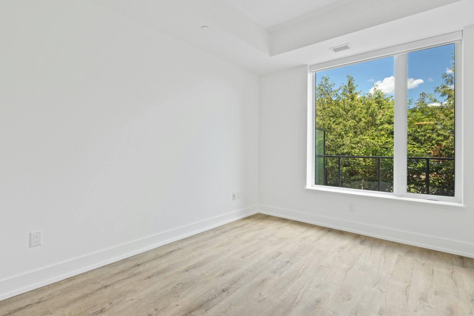 A bare room before work begins, lit from one window