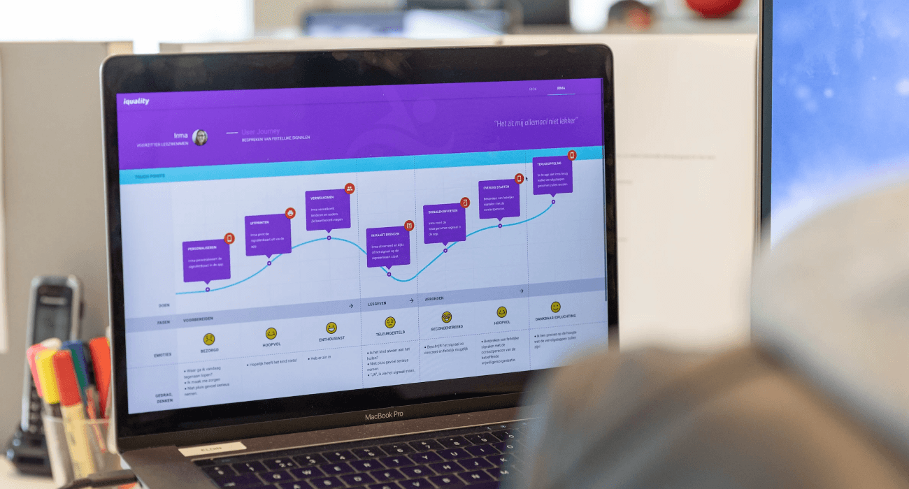 Team members in an office setting having a discussion, representing clear communication throughout the project process.