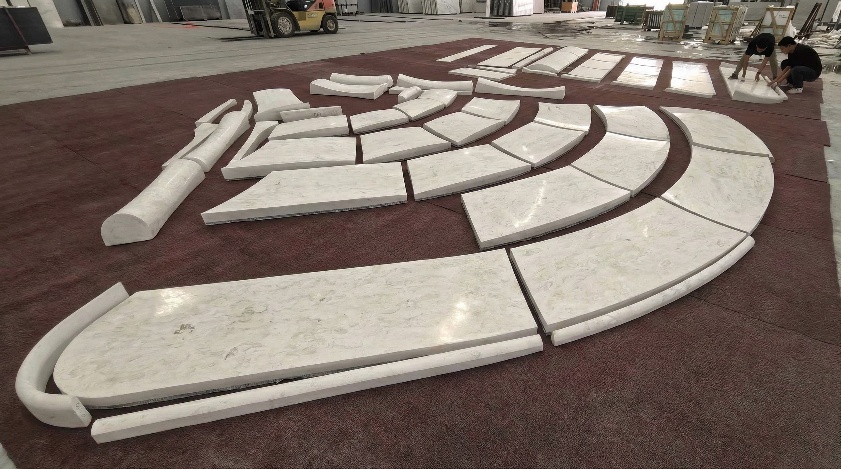 Full-scale dry-lay assembly of a bespoke marble entrance canopy by NOVA STONE in the workshop