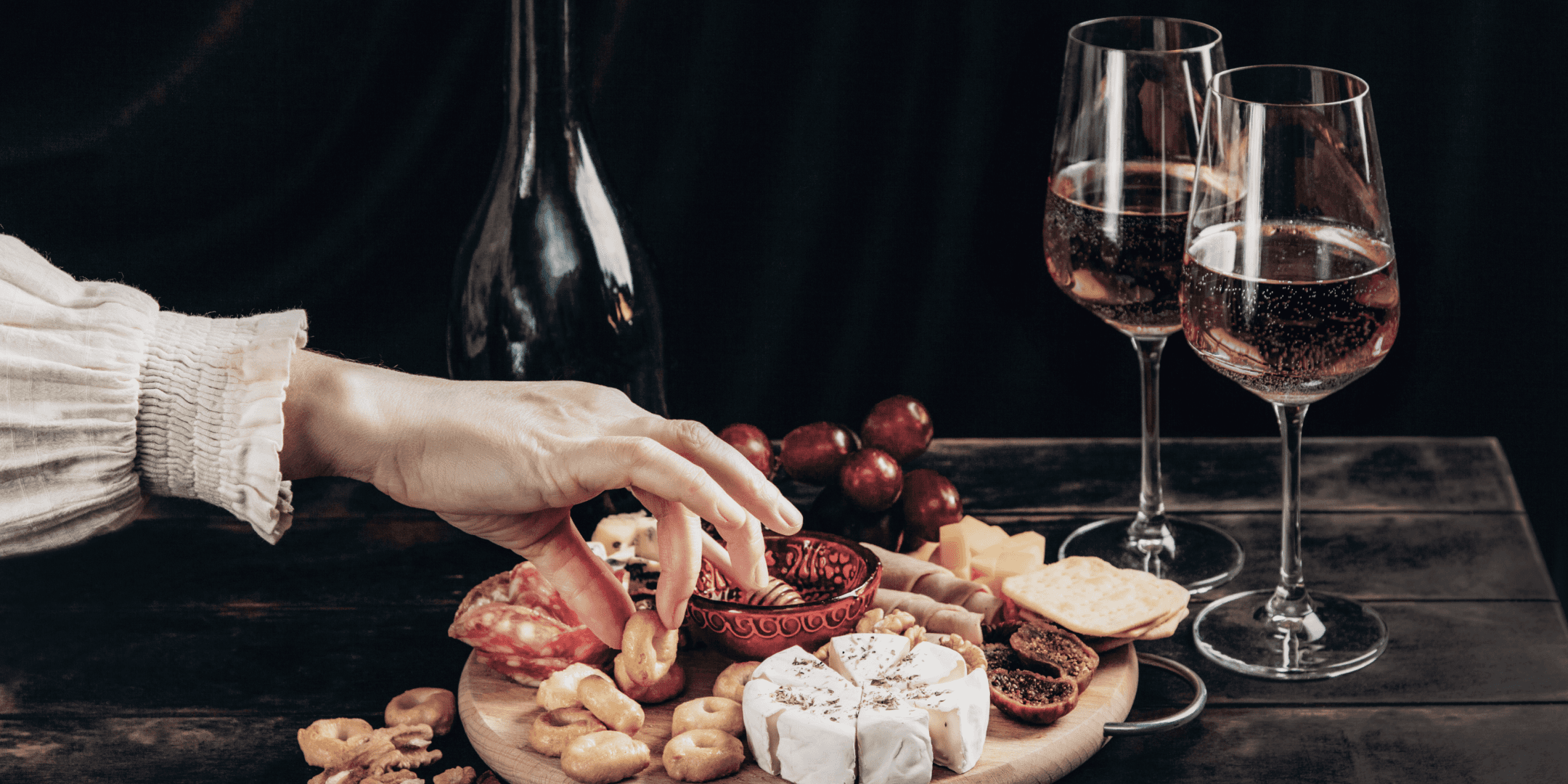  A person's hand reaching for food