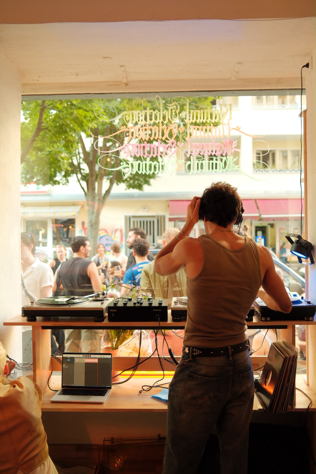 DJ at the window.