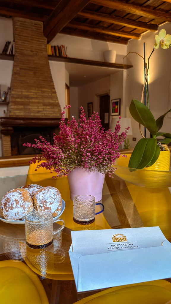 Dark wood console table with tall blue vases