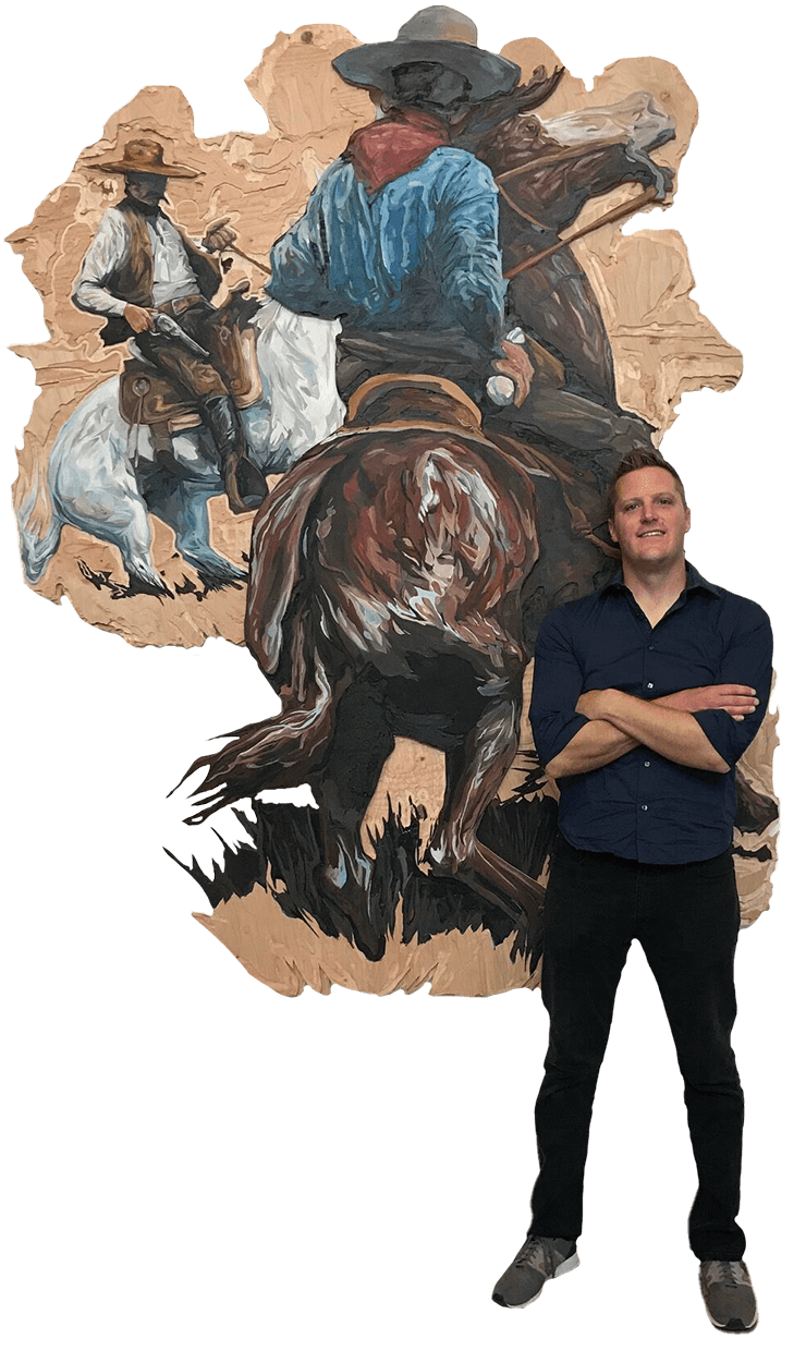 A cutout image of Cody standing in front of his piece, "Across the Intervening Desert," that is a large piece of two cowboys riding horses and facing each other.