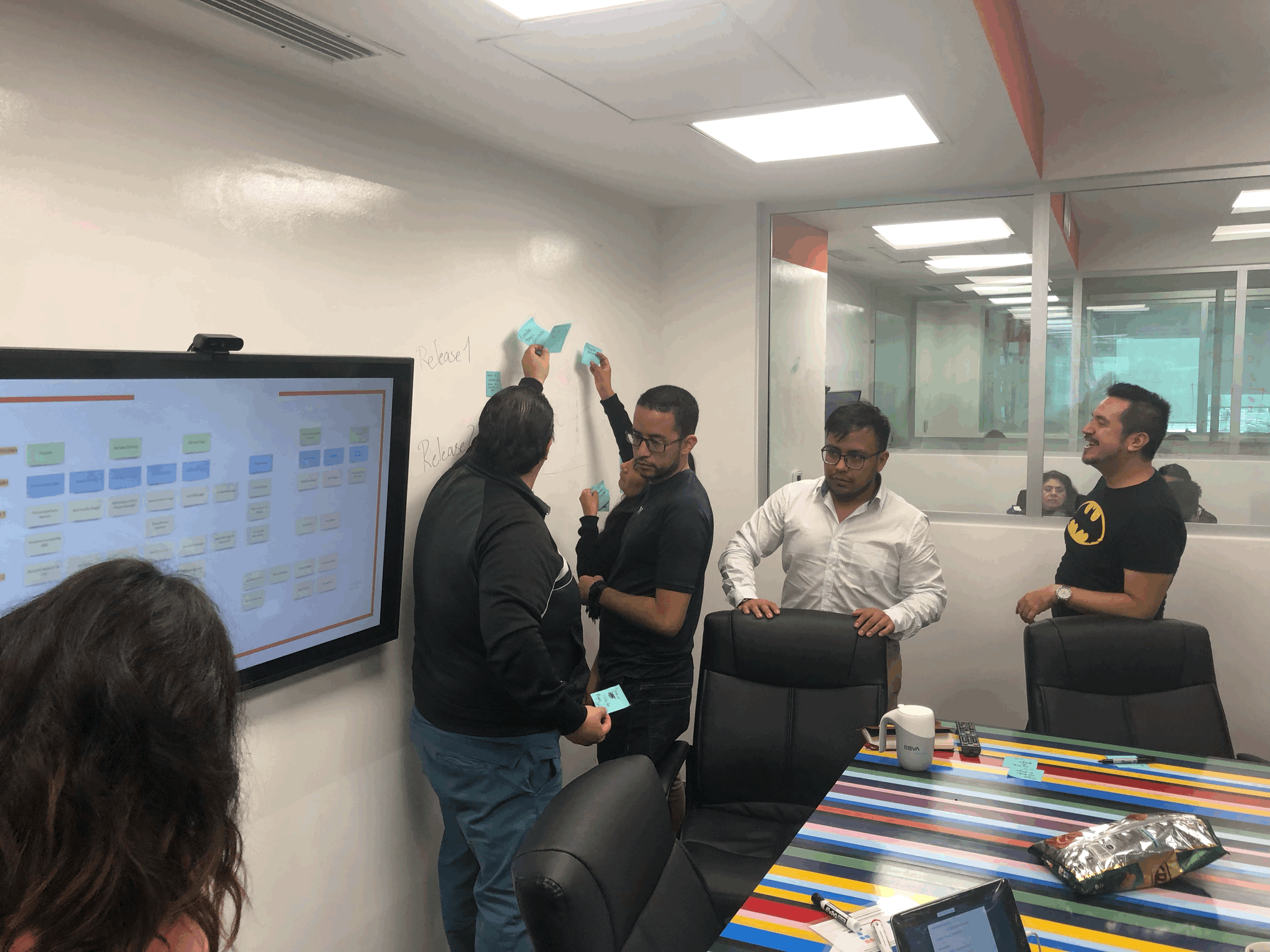 Image of people working at their computers in an office