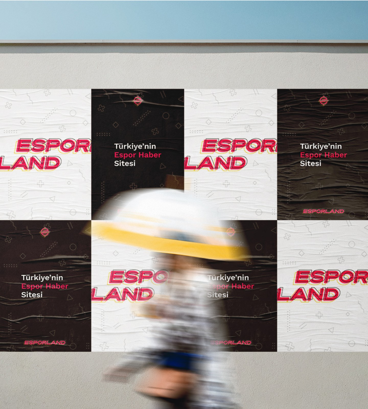 a woman walking past posters of Esporland