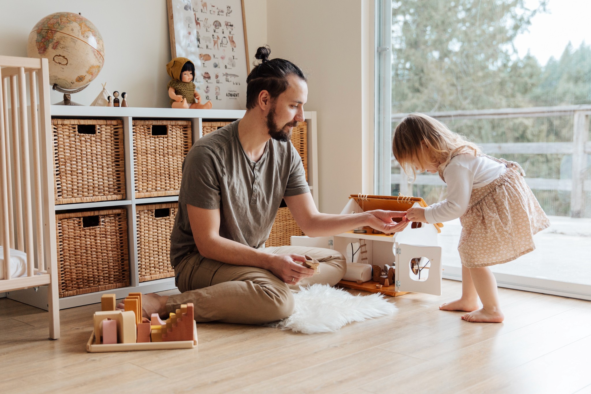 Female child playing and building with dad