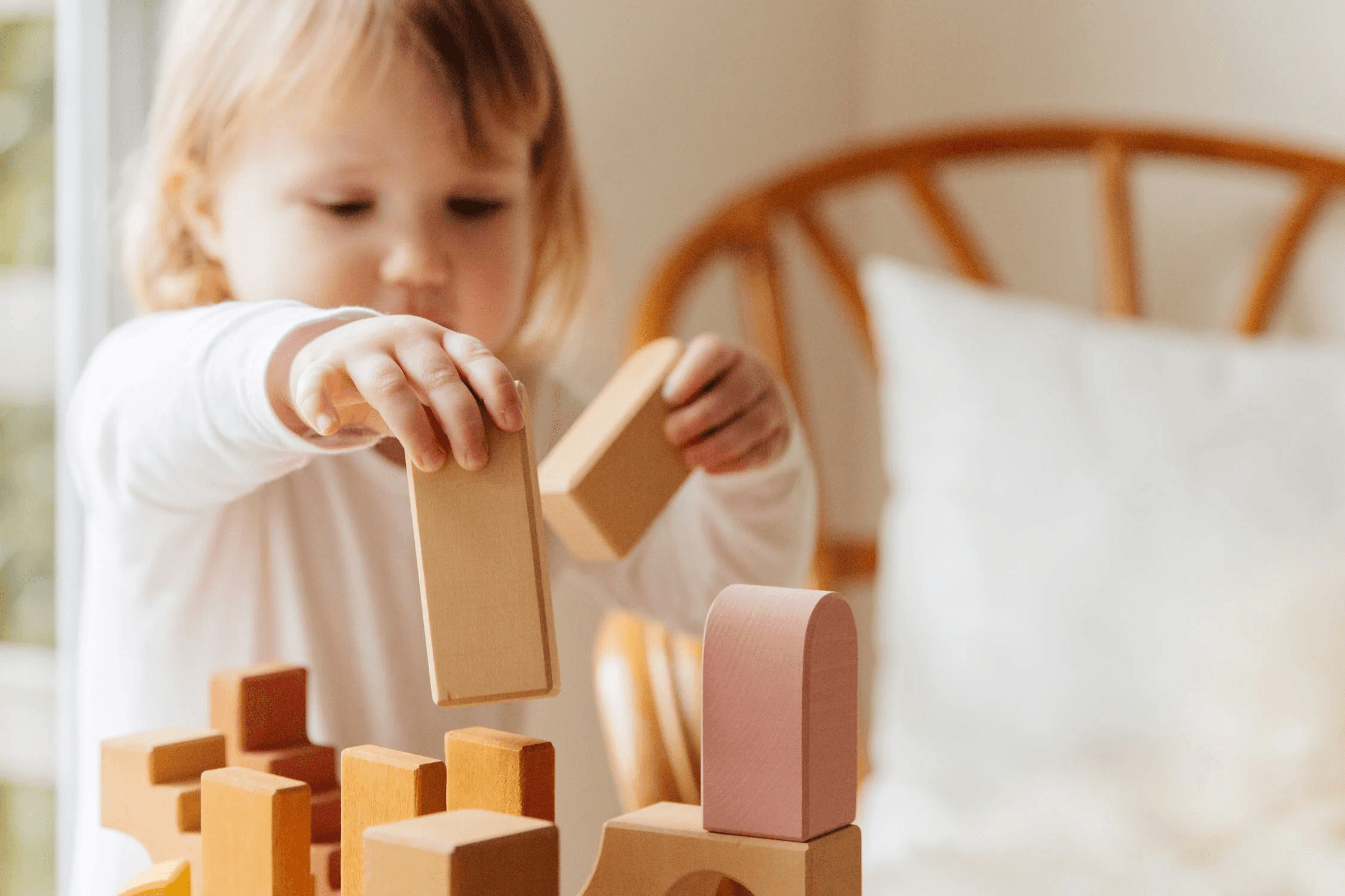 Female child playing with occupational therapy blocks