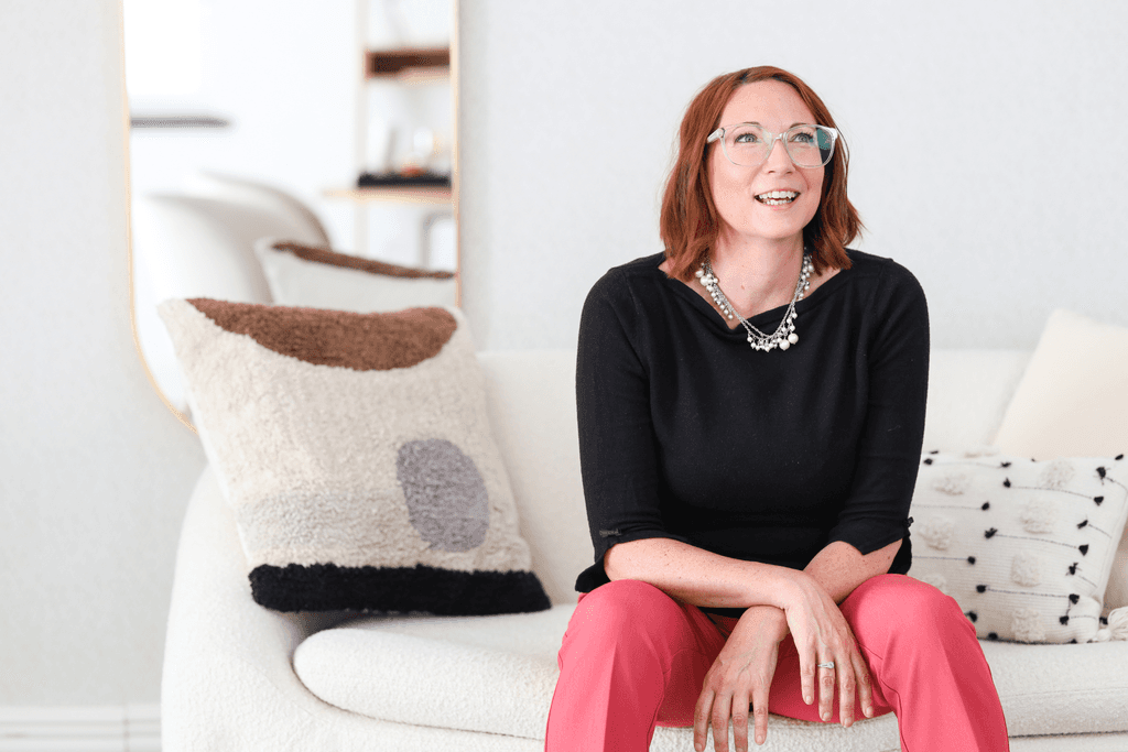 Stephanie sitting on sofa, smiling