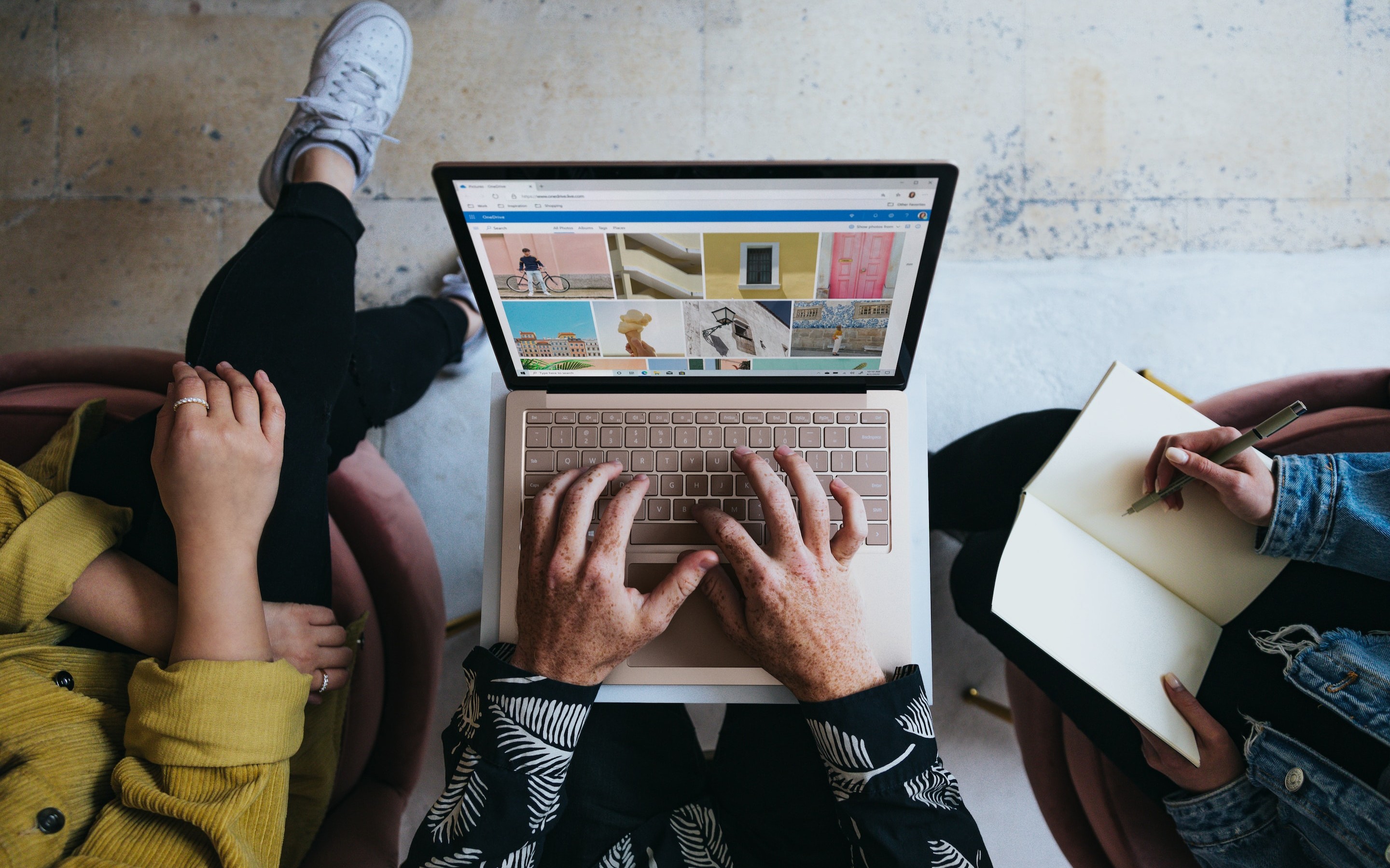 three people looking for inspiration on a computer