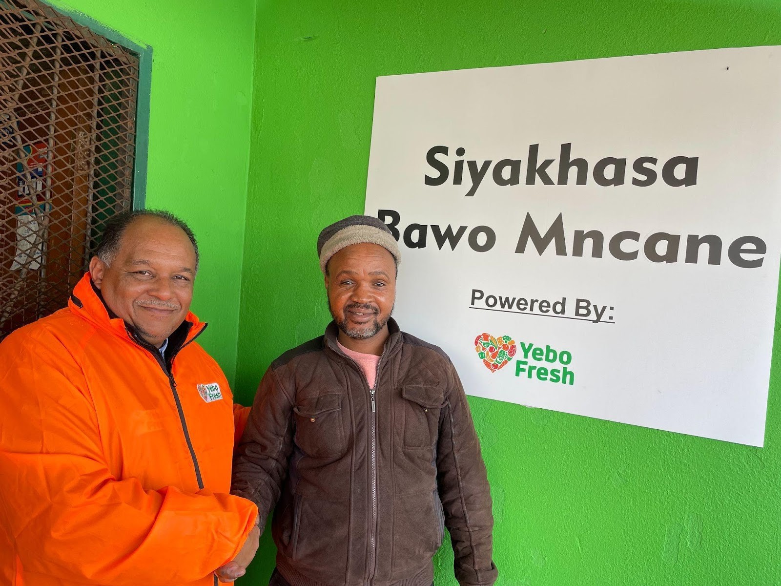 Sales Manager Moeneer with Shop Owner Bawo Mncano