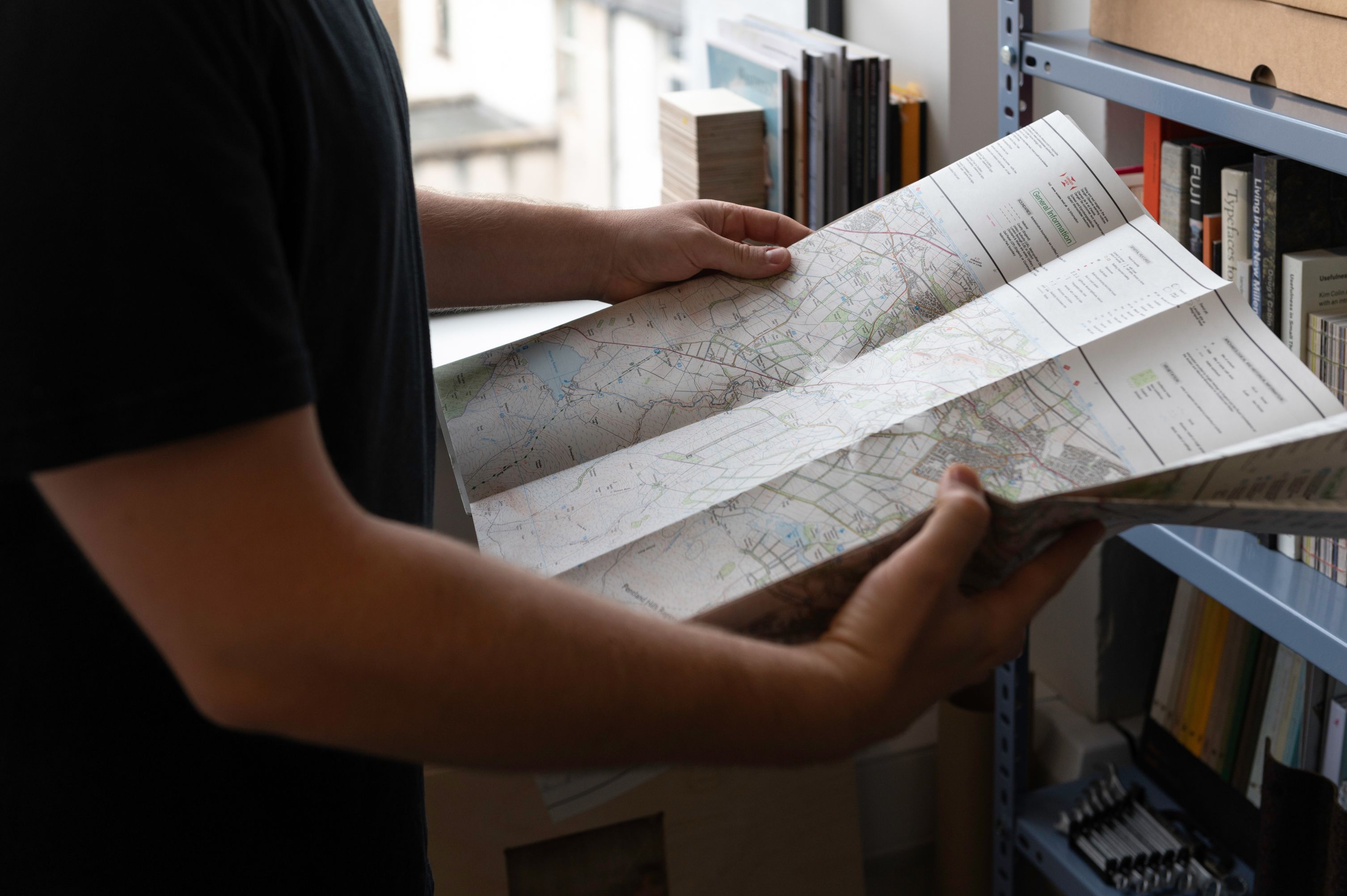 Adam holding a map