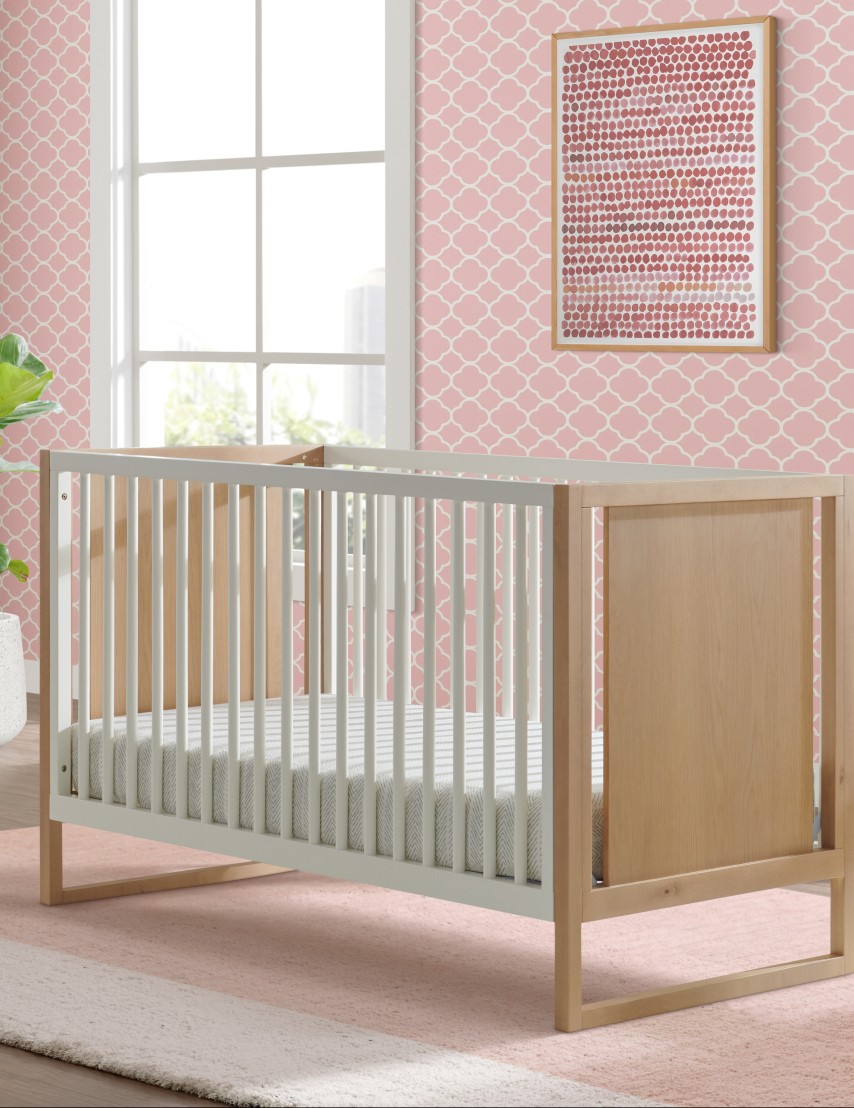 a crib in a pink room